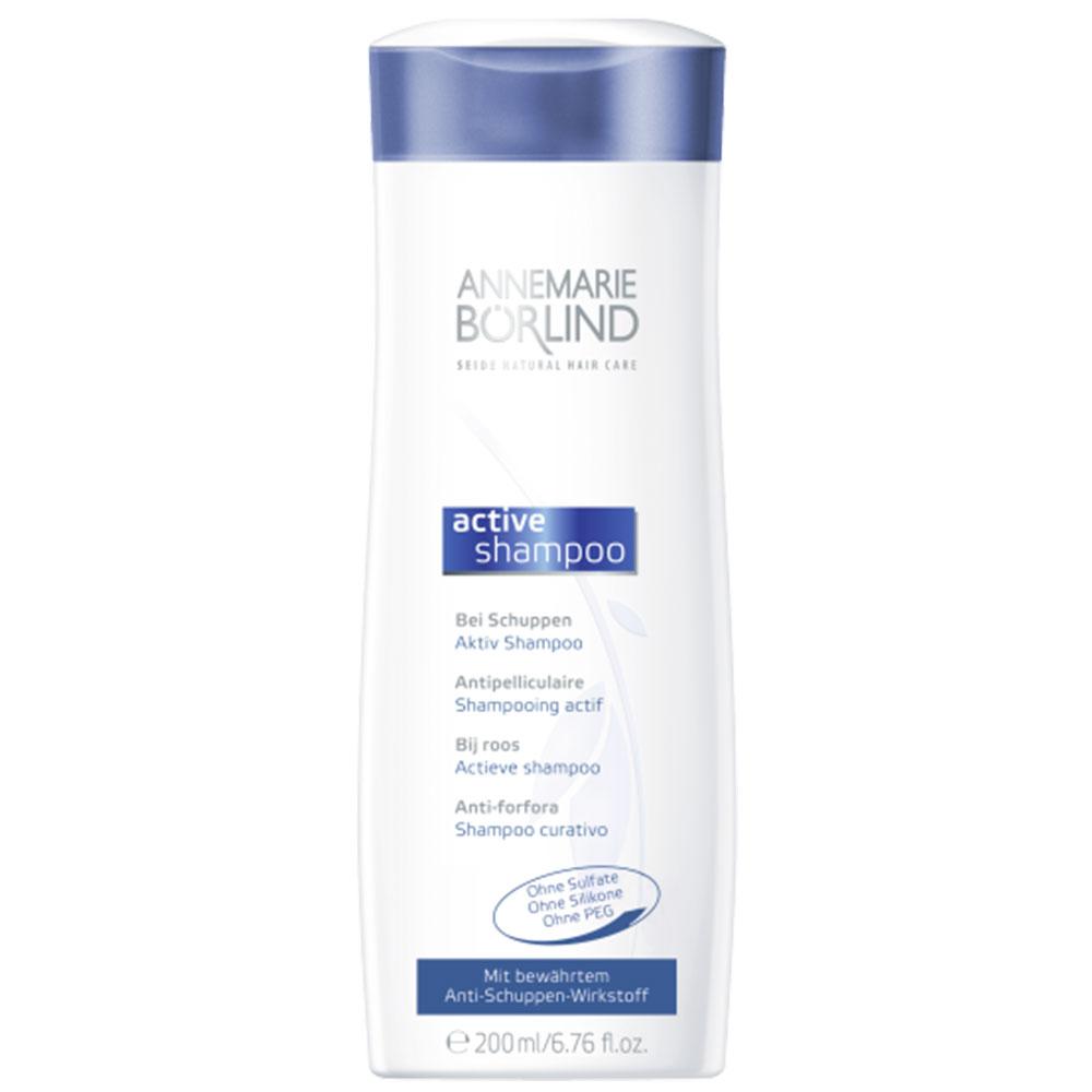 Weiße Shampoo-Flasche mit blauem Deckel und Text über Anti-Schuppen-Wirkung.